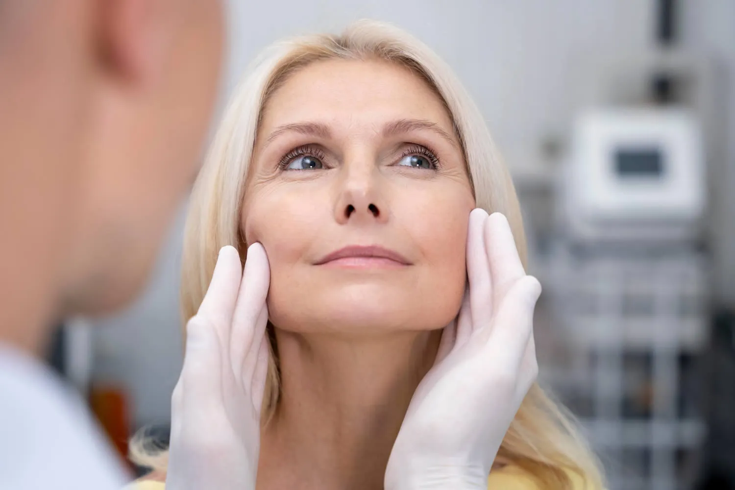 close-up-doctor-checking-smiley-woman